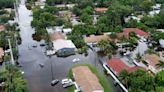 Tropical rainstorms in South Florida lead to flight delays and streets jammed with stalled cars