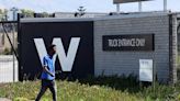 S.Africa's Woolworths shares tumble 7% as retailer flags over 20% drop in FY profit