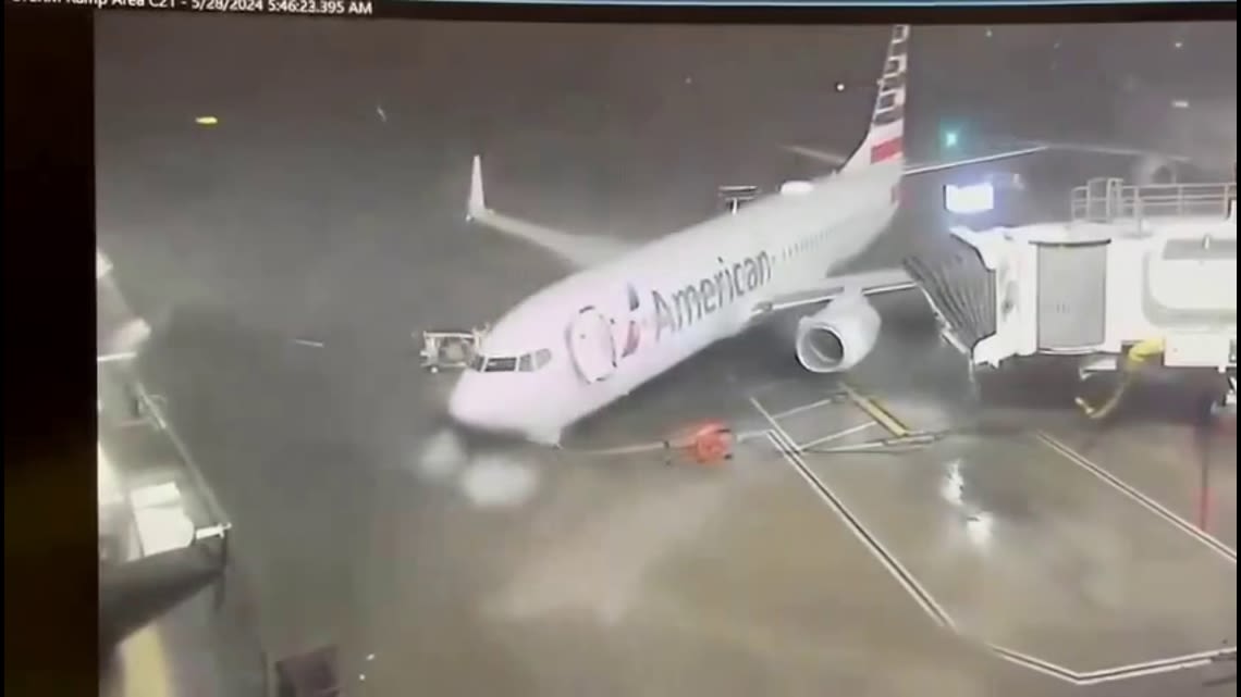 WATCH: Strong winds push American Airlines plane away from gate at DFW Airport