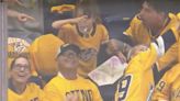 Hockey crowd erupts when daughter mimics dad’s chugging