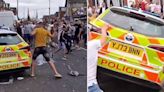 Chaos on streets of Leeds as angry rioting mob smashes up police cars