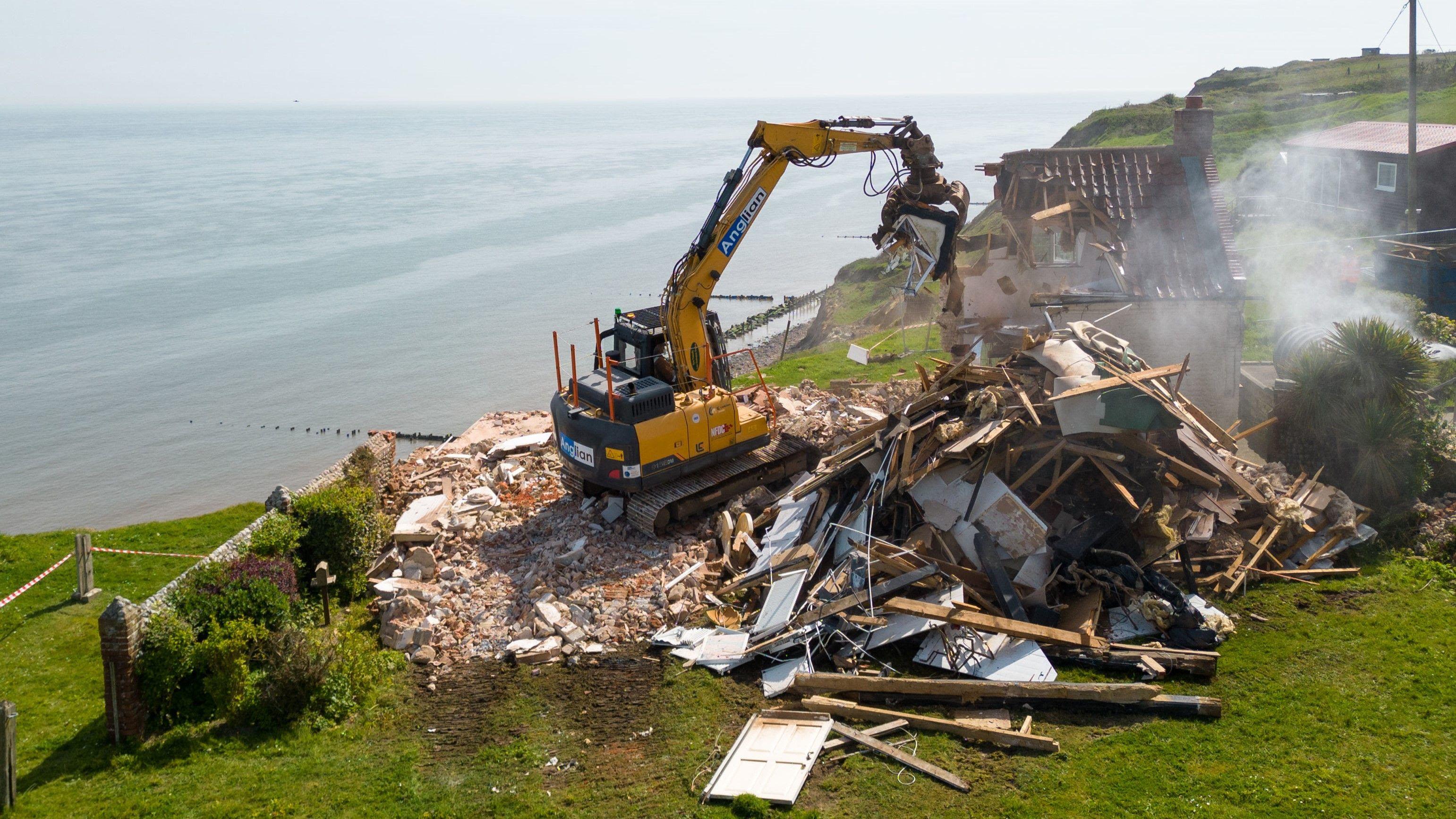 Farmhouse teetering over cliff edge demolished