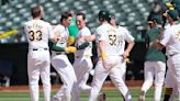 A's hit 2 tying homers in late innings and score 5 runs in 11th to rally past Rockies 10-9