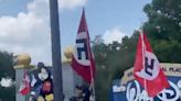 Protesters carrying Nazi flags and DeSantis imagery gathered outside Disney World in Orlando, Florida