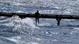 See surfers hit Lake Tahoe’s ‘pretty rowdy’ waves as wind kicks up amid snowy mountains