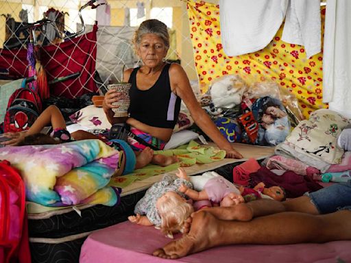 Flooding forecast to worsen in Brazil's south, where many who remain are poor