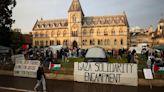 With bright tents and sombre mood, protesting UK students show solidarity with US peers