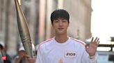 BTS’ Jin makes ARMY proud as he becomes the 1st Korean artist to lift the Olympic Torch! - The Economic Times
