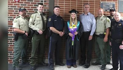 Officers attend high school graduation for fallen officer’s daughter