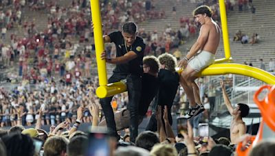 Vanderbilt and Arkansas receive six-figure fines after fans storm the field in upset wins