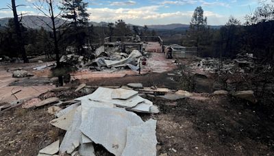 Tour behind Alexander Mountain Fire lines reveals both total destruction and spared homes