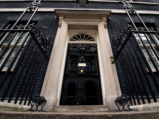 Who else lives in Downing Street apart from the prime minister?