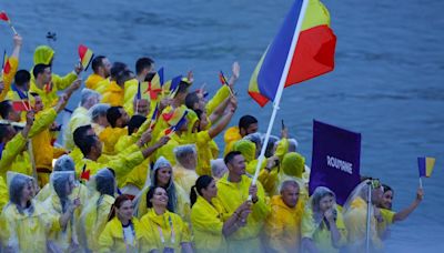 Olympic moment of the day: Married couple makes history as Romania’s flag bearers | CNN