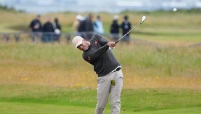 Adam Scott brings his game to Royal Troon with positive results.