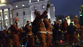 Skaters take over London streets wearing Santa outfits to provide festive cheer