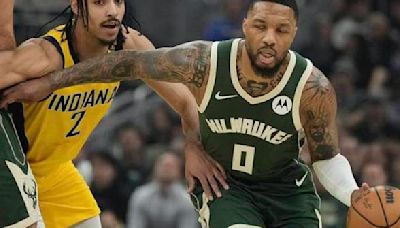 Damian Lillard's 35-point 1st half helps Bucks beat Pacers 109-94 without Giannis in playoff opener