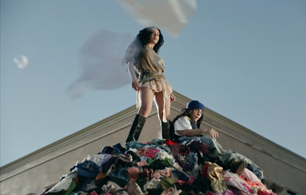 Charli XCX & Billie Eilish Donate “Guess” Video Underwear to Domestic Violence Survivors