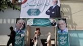 Iranians vote in run-off presidential election amid widespread apathy