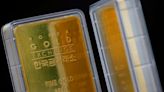 Gold jumps 1% as Fed's Powell says smaller rate hikes on the way