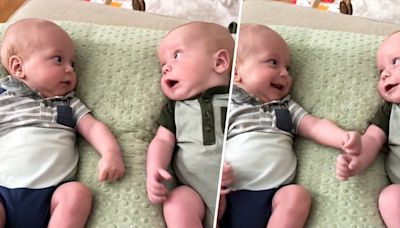 Watch these adorable twin babies meet each other for the first time