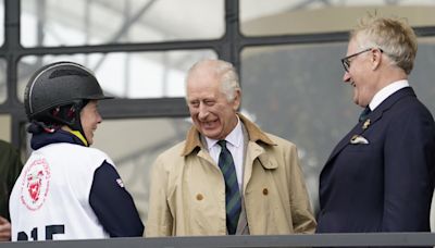 King smiles on visit to Queen Elizabeth II’s favourite horse show as he resumes public duties