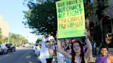 Activists protest about women's health care rights outside Rep. Jackson's office