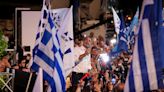 Greek conservatives storm to victory in repeat election