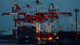 Weak yen lifts Japan's exports but higher import bills hurt business mood