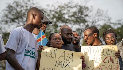 Families of the victims of attacks on displaced people in Congo mourn their dead