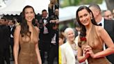 Bella Hadid Elevates Sheer Dressing Trends in Saint Laurent Brown Midi Look for ‘The Apprentice’ Cannes Film Festival...
