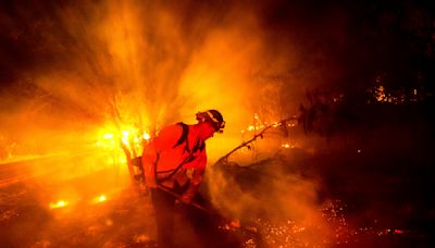 Firefighters gain ground against Southern California wildfire but face dry, windy weather