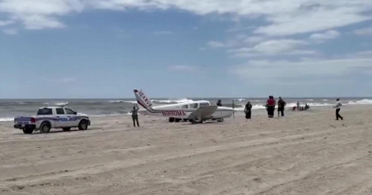 Small plane lands on beach on New York's Fire Island