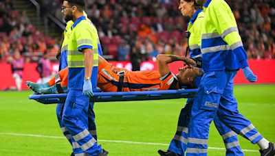 Nathan Ake leaves pitch on stretcher in major injury concern for Man City