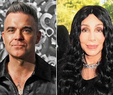 Robbie Williams Was Accidentally 'Rude' to Cher in an Airport by Walking Away Before She 'Finished Talking'