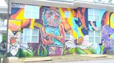Muralists transform Midtown apartment building with new look