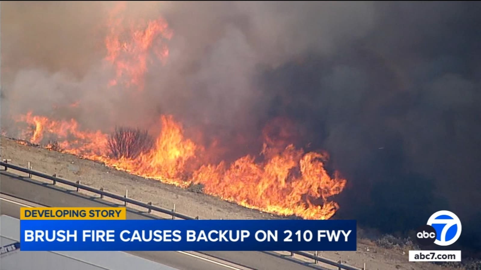 Crews get upper hand on fast-moving brush fire burning along eastbound 210 Freeway in Sunland