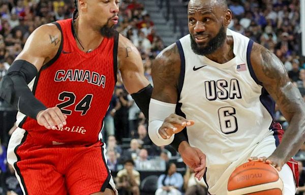 The United States' LeBron James drives against Canada's Dillon Brooks...Games, at T-Mobile Arena on July 10, 2024, in Las Vegas.