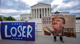 The Latest: Trump takes to social media before Supreme Court arguments