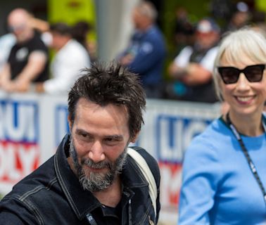 Keanu Reeves, girlfriend Alexandra Grant hop on motorbike at Grand Prix in Germany