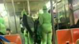 Six women in neon green jumpsuits rob and beat two women on NYC subway