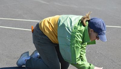 Eagle Scout project returns painted rose compass to Lansing airport taxiway