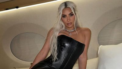 Kim Kardashian Strikes a Pose in Leather Set on Bed in Her Private Jet — Yes, There's a Corset