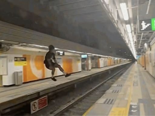 Hong Kong police investigate after viral video shows man leaping between MTR platforms