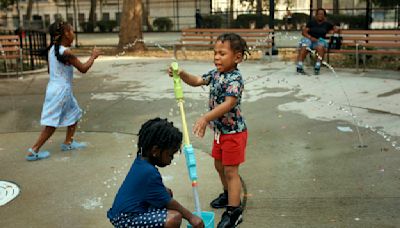 Scorched by history: Discriminatory past shapes heat waves in minority and low-income neighborhoods