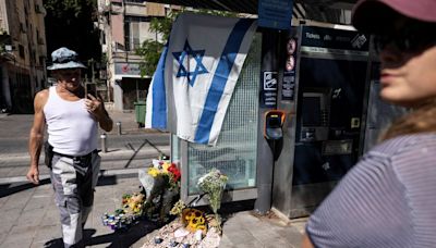 Israelis hold vigil at Tel Aviv train stop after Palestinian shooting attack