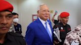 Sentence halved for Malaysia's ex-PM Najib, jailed in 1MDB scandal