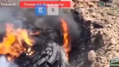 A Russian tank stuck in a large crater became a sitting duck for Ukraine's drones, a video appears to show