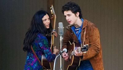 Timothée Chalamet Takes the Stage as Bob Dylan with Guitar and Harmonica on Set of “A Complete Unknown”