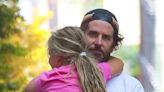 Bradley Cooper carries daughter Lea in his arms during stroll in NYC