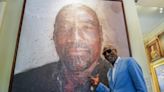 Vivian Richards poses with his portrait at Lord’s during England vs West Indies first Test